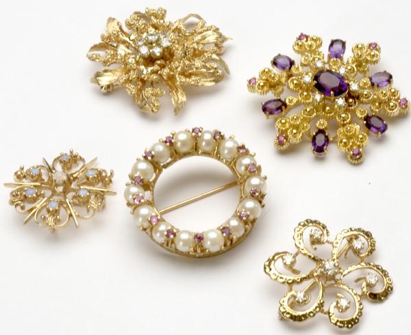 Appraisal: FIVE GOLD AND GEMSTONE BROOCHES k snowflake with amethysts rubies