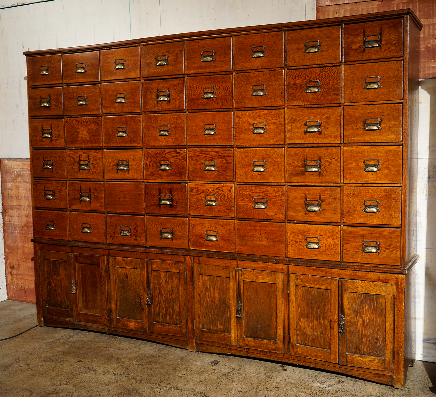 Appraisal: AN EXCEPTIONAL MID CENTURY COMPARTMENTAL CHEST WITH LOWER CUPBOARDS drawers