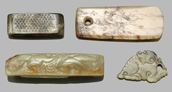 Appraisal: A group of small archaistic jade carvings Including three sword