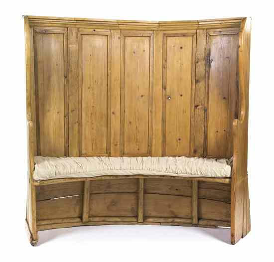 Appraisal: A Pine Welsh Hall Bench having a curved back in