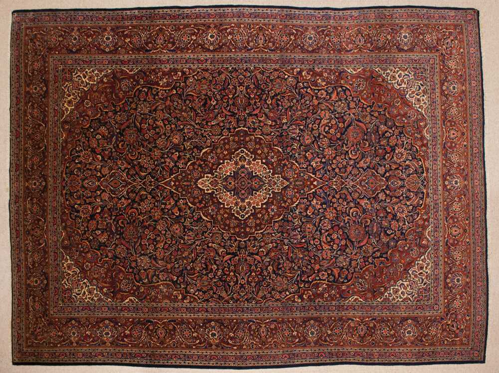 Appraisal: SEMI-ANTIQUE PERSIAN KASHAN CARPET floral and central floral medallion design