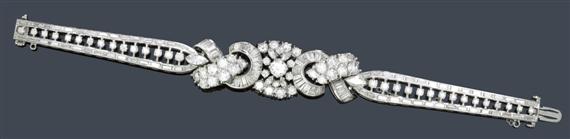 Appraisal: A DIAMOND BRACELET circa Platinum-palladium alloy Very decorative pierced bracelet