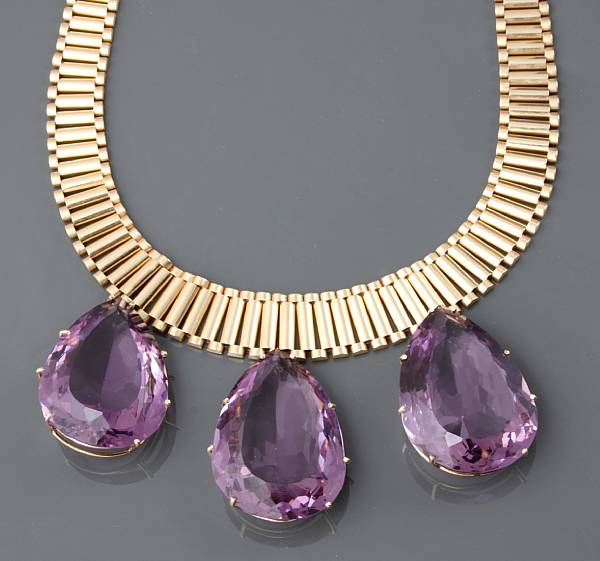 Appraisal: A k gold tubelink necklace with three large amethyst drops