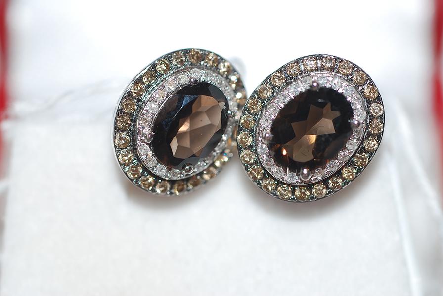 Appraisal: A PAIR OF SMOKEY QUARTZ AND DIAMOND EARRINGS SET IN