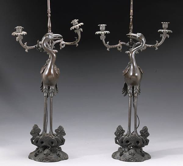 Appraisal: A pair of patinated bronze candelabra Meiji Taisho Period Each