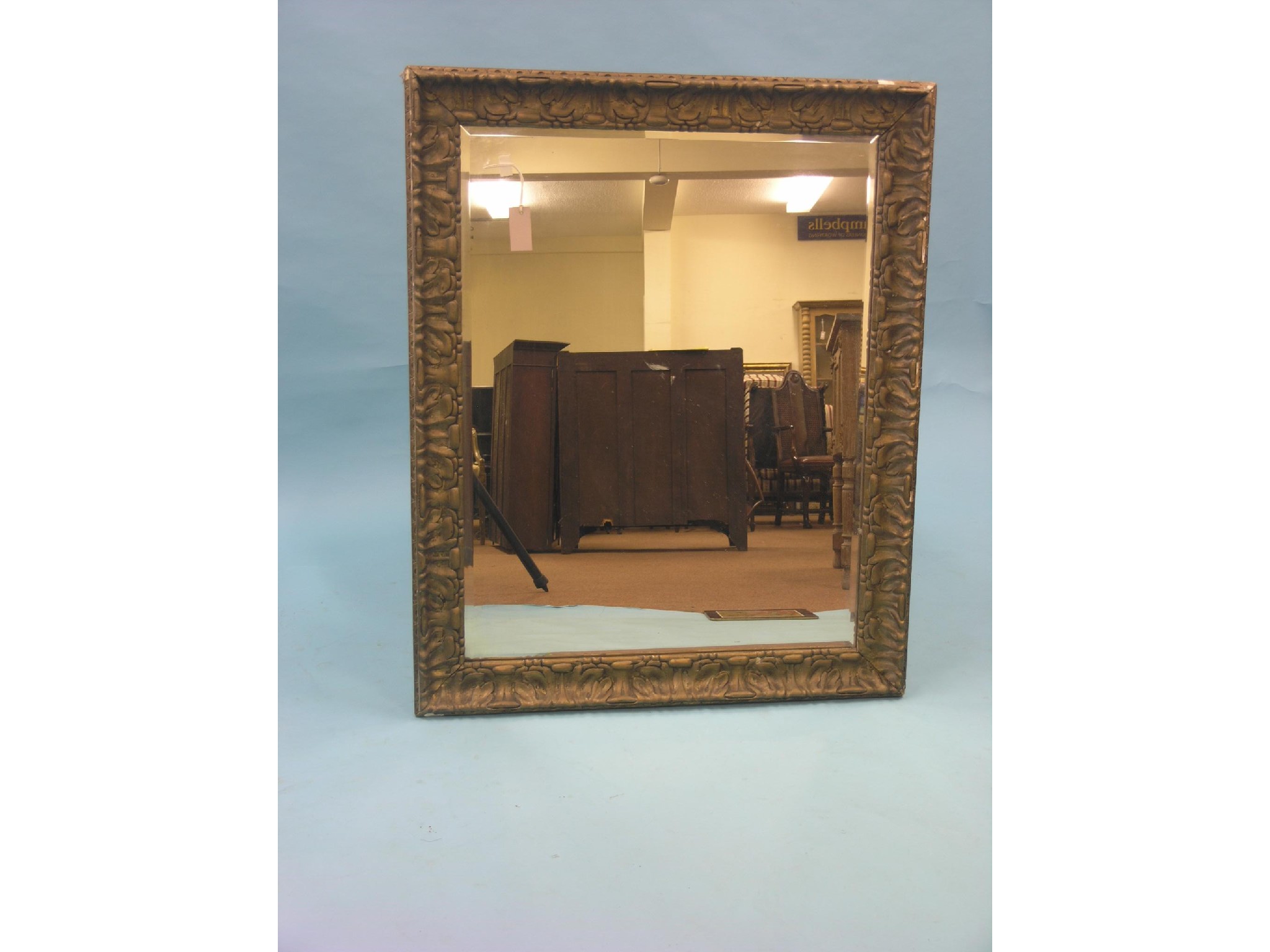 Appraisal: A large Victorian bevelled mirror rectangular-shape with moulded gilt frame