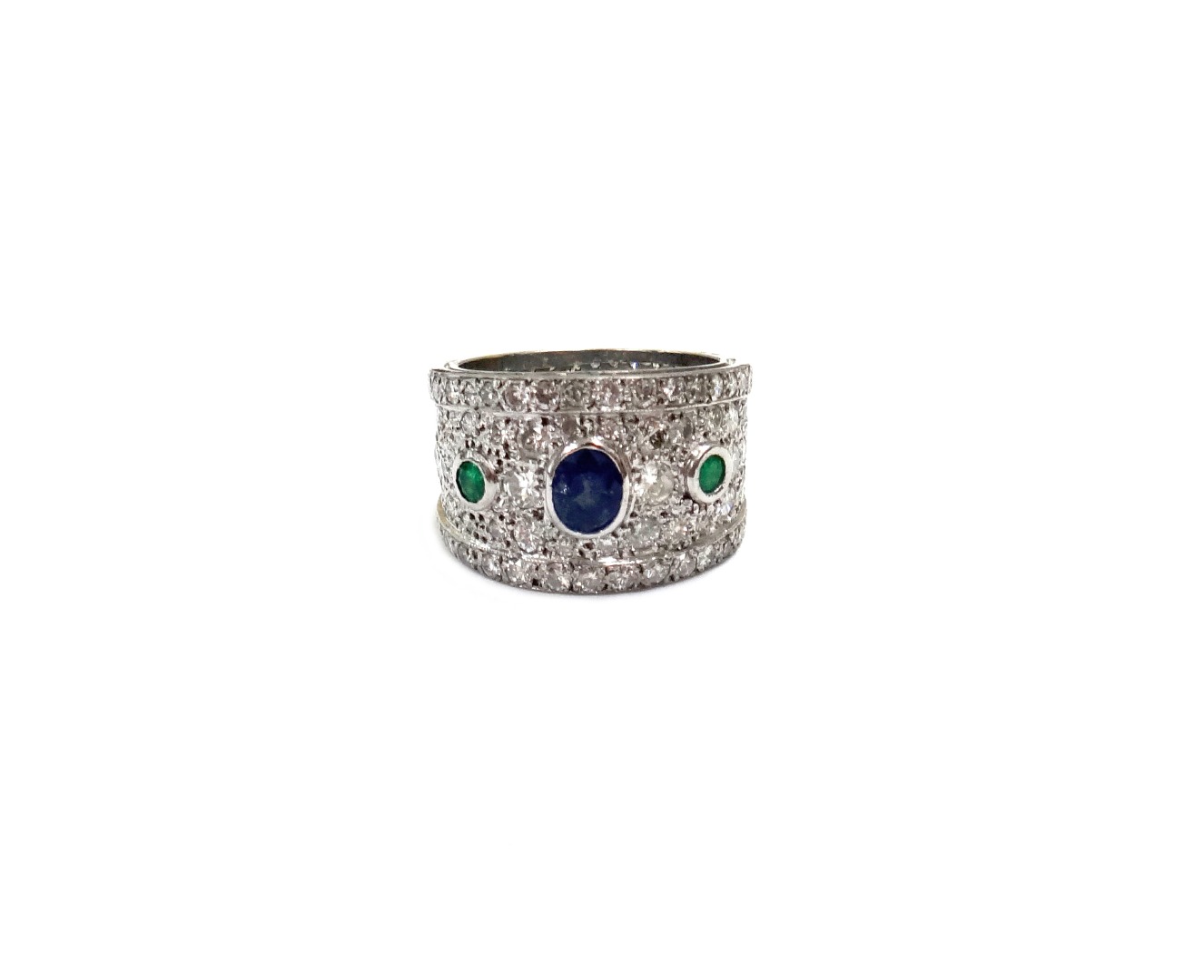 Appraisal: An emerald sapphire and diamond broad band ring the front