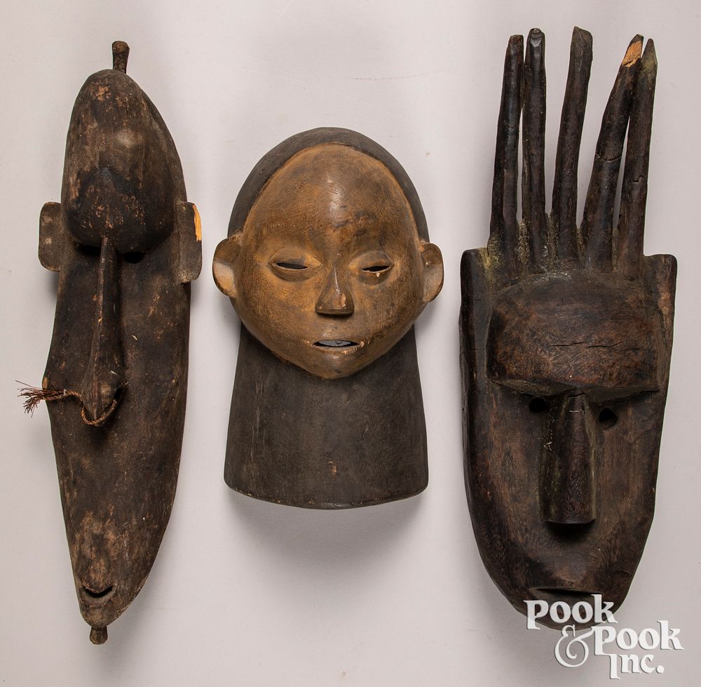 Appraisal: Three carved African masks Three carved African masks to include