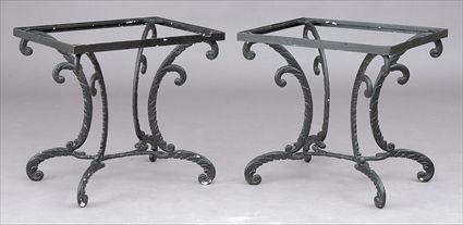 Appraisal: PAIR OF CAST IRON SIDE TABLES Regency-style with featherlike supports