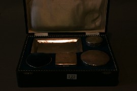 Appraisal: A boxed continental silver dressing table set