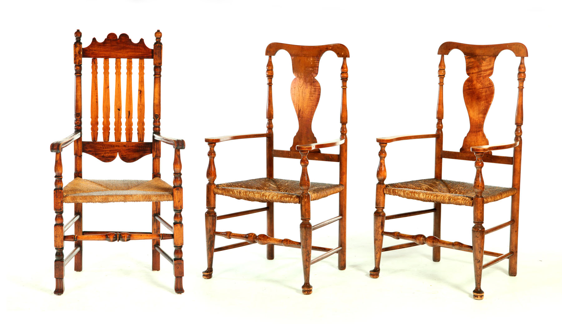 Appraisal: THREE ARMCHAIRS New England th- th century maple Banister-back with