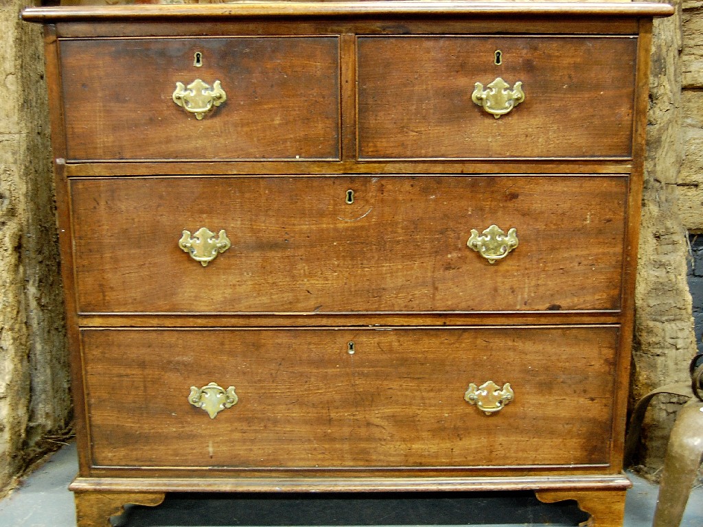 Appraisal: A George III mahogany chest of two short over two