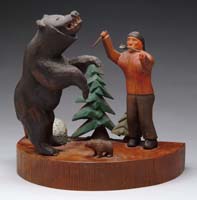 Appraisal: WOOD CARVING OF BEAR ATTACK The carved and painted sculpture