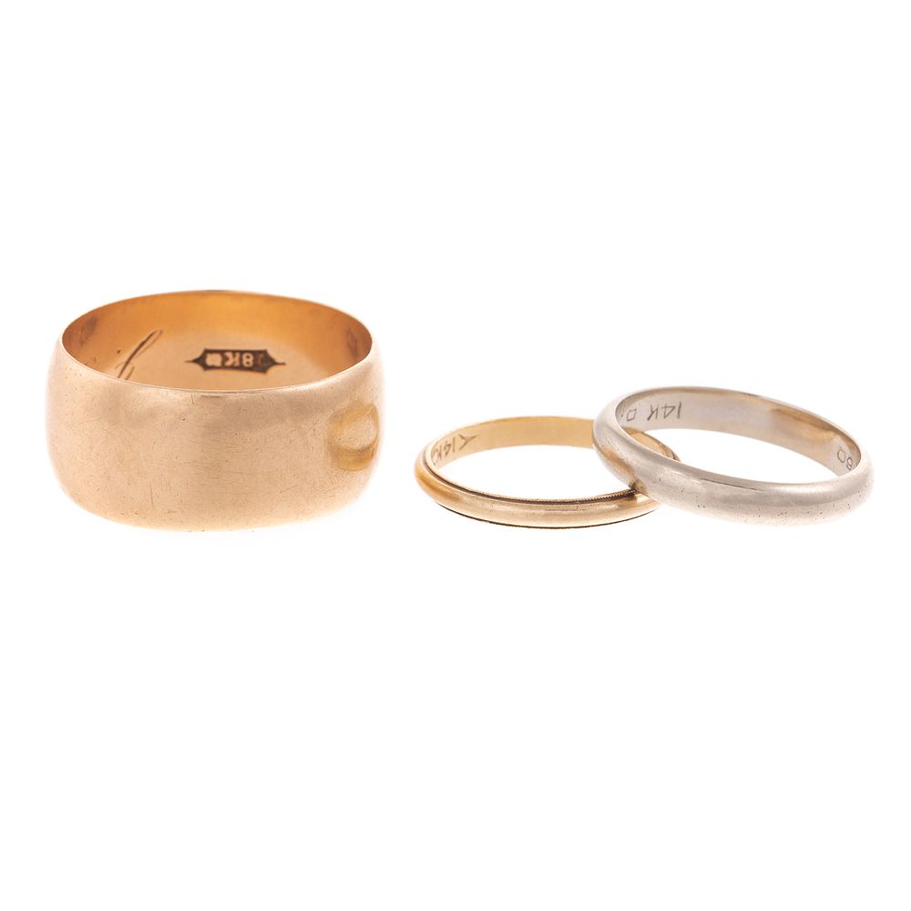 Appraisal: A Trio of Gold Wedding Bands K yellow gold wide