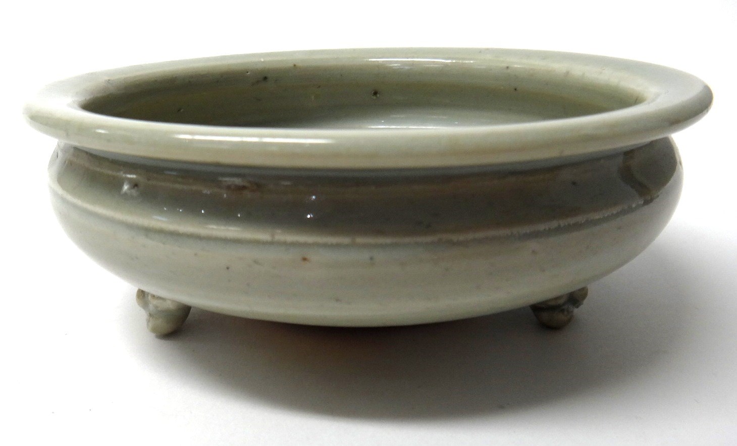 Appraisal: A small Chinese celadon tripod censer Ming Dyansty of compressed