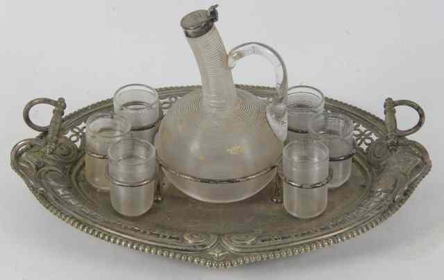 Appraisal: A silver plated drinks tray fitted with a silver mounted