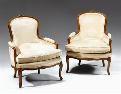 Appraisal: Pair of Louis XV style bergeres The arched foliate carved