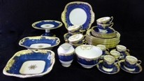 Appraisal: A Crown Staffordshire part dinner service blue ground with gilt