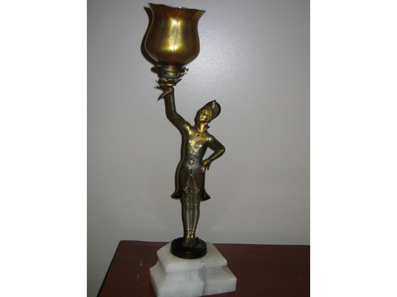 Appraisal: GERMAN ART DECO FIGURAL TABLE LAMP the polychrome spelter standing