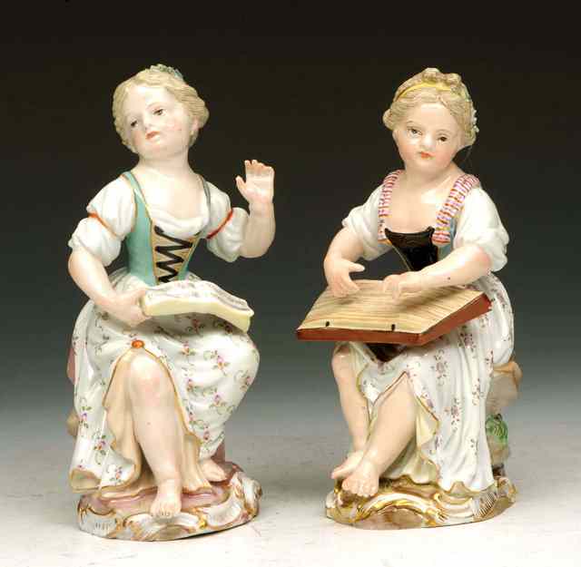 Appraisal: A PAIR OF MEISSEN PORCELAIN FIGURES of a girl seated