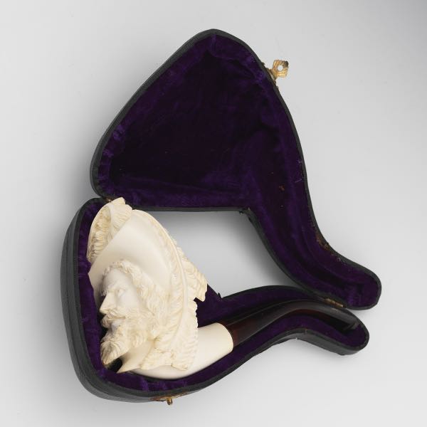 Appraisal: MEERSCHAUM AND FAUX AMBER CARVED PIPE LOUIS XIII STYLE CAVALIER