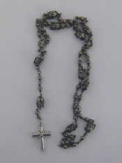 Appraisal: A silver 'Fantasy' rosary composed of circular and serpent and