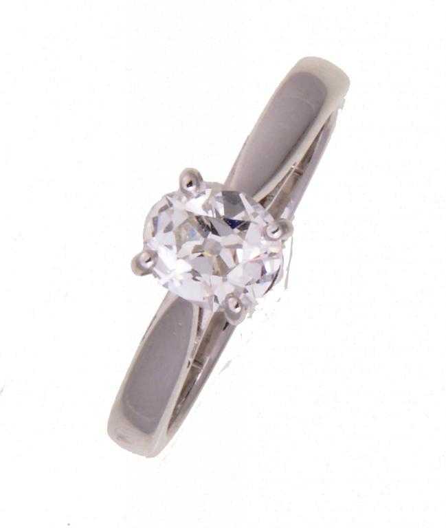 Appraisal: A DIAMOND SOLITAIRE RING with an old cut cushion shaped