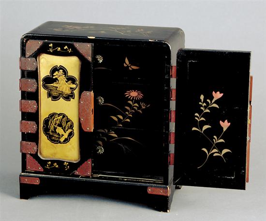 Appraisal: Miniature Japanese lacquerware cabinet early th centuryfloral-decorated top over two