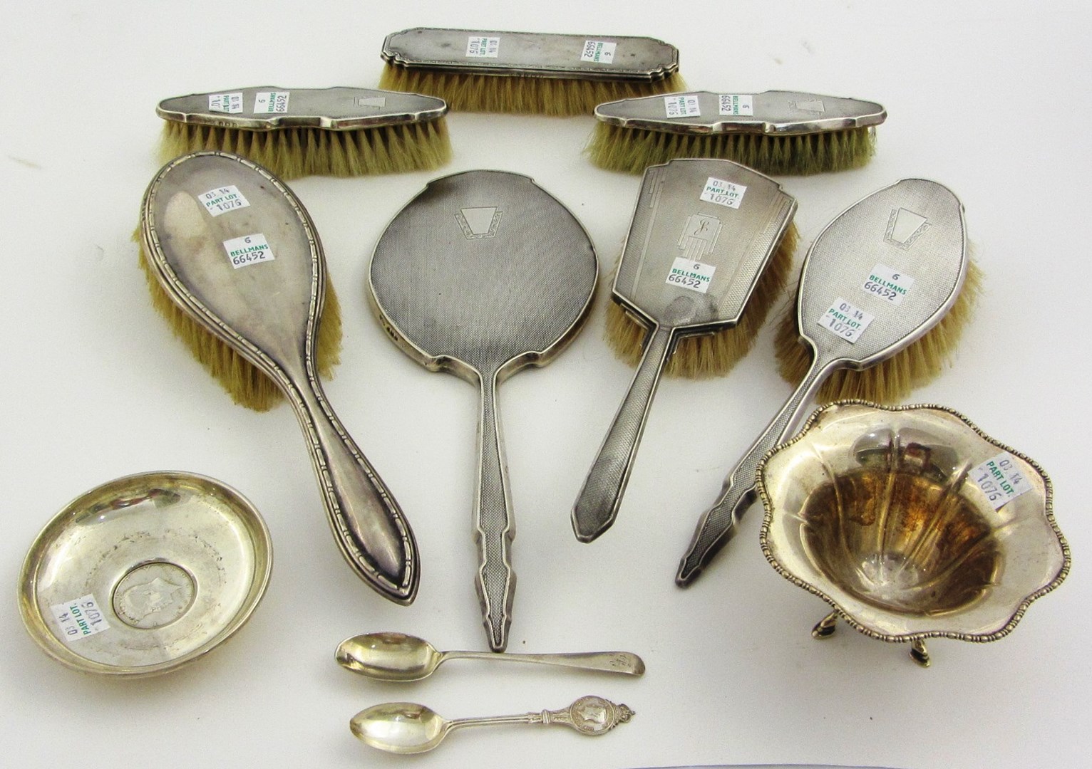 Appraisal: Silver mounted dressing table wares comprising three hairbrushes a hand