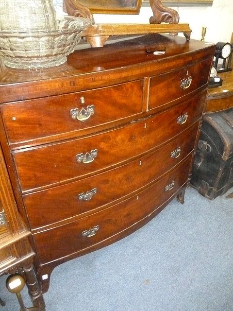 Appraisal: A VICTORIAN MAHOGANY BOW FRONTED CHEST of two short and