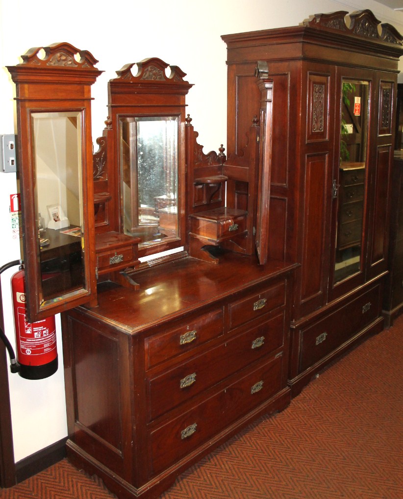 Appraisal: A late Victorian walnut bedroom pair comprising wardrobe with triple