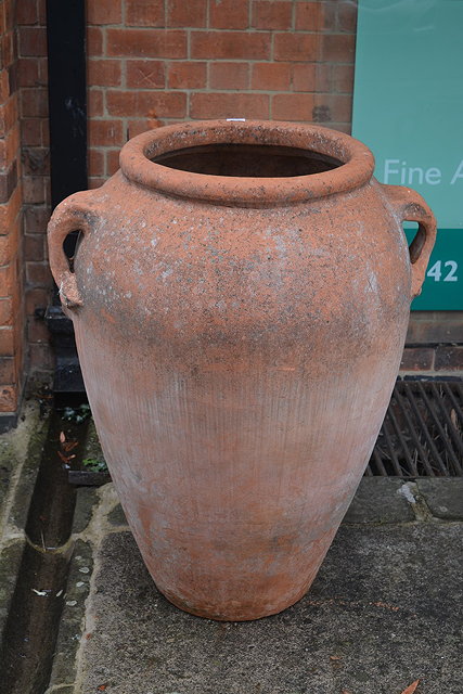 Appraisal: A large terracotta porthoi potwith double loop handles cm high