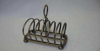 Appraisal: A TOAST RACK maker Maxfield Sons Sheffield of rounded oblong