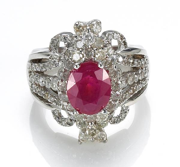 Appraisal: A ruby and diamond ring centering an oval-shaped ruby weighing