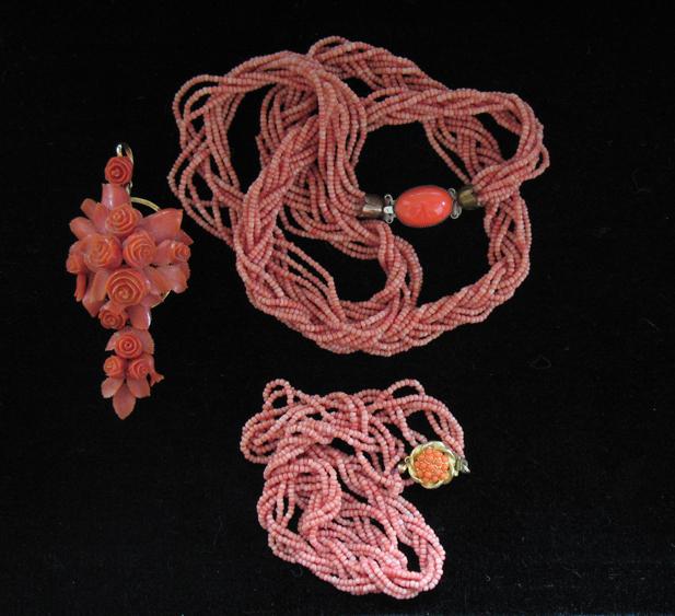 Appraisal: AN EIGHT ROW STRING OF CORAL BEADS twisted together to