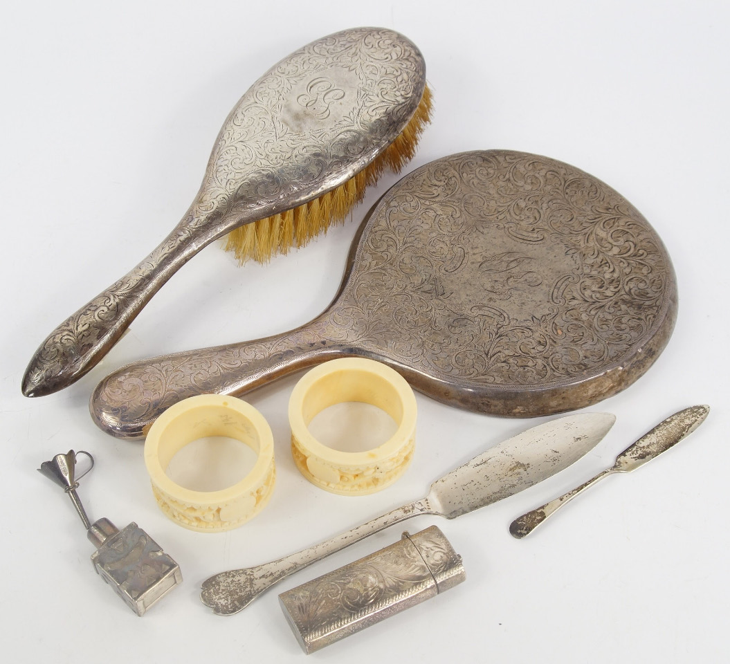 Appraisal: A George V silver backed hair brush and hand mirror