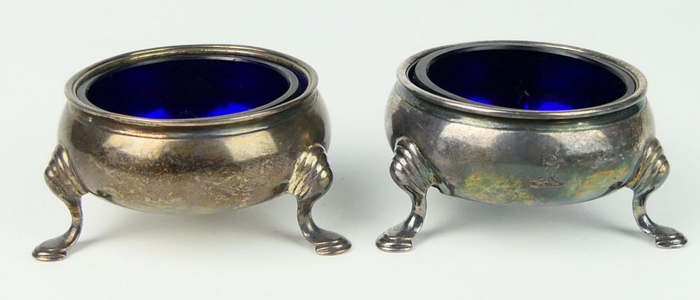 Appraisal: PAIR OF ANTIQUE STERLING FOOTED COBALT LINED SALTS Made in