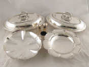 Appraisal: Silver plate A pair of entree dishes a swing handled