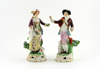 Appraisal: A pair of Derby models of shepherds she with an