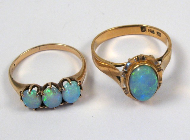 Appraisal: TWO OPAL AND YELLOW GOLD RINGS one k yellow gold