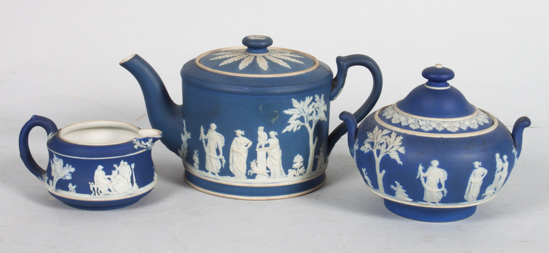 Appraisal: Wedgwood jasperware three-piece tea set th century drum-form teapot cream