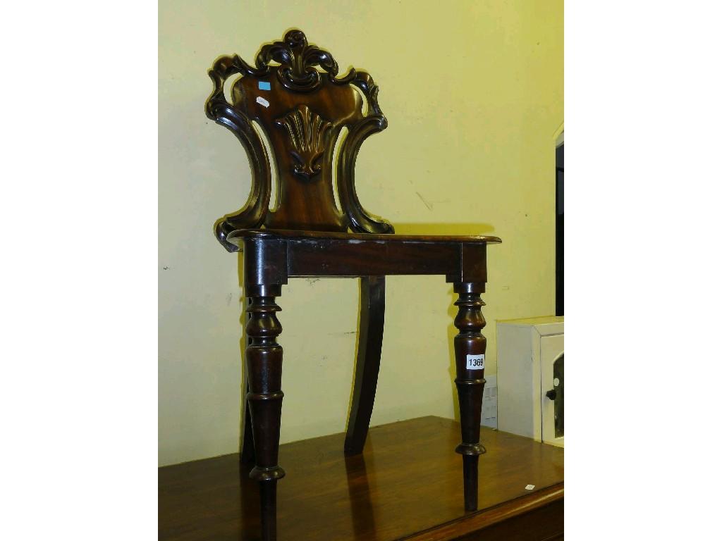 Appraisal: A th century mahogany hall chair the raised shield shaped