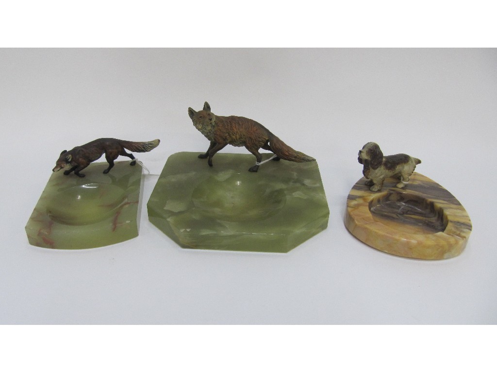 Appraisal: Three Art Deco ashtrays each with cold painted figures of