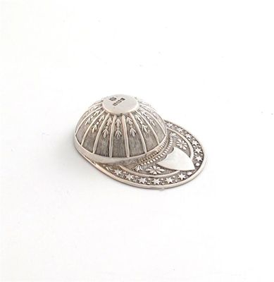 Appraisal: An Edwardian silver jockey cap caddy spoon by Thomas Bradbury