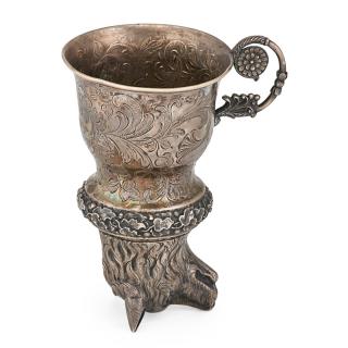 Appraisal: AUSTRIAN SILVER STIRRUP CUP Chased foliate design featuring a cartouche