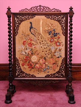 Appraisal: ELIZABETHAN REVIVAL ROSEWOOD FIRESCREEN The pierced crest with scrolling leaves