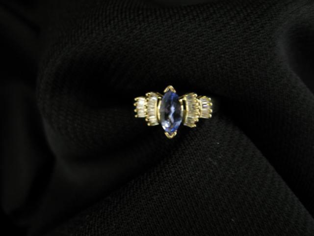 Appraisal: Tanzanite Ring marquise carat gem with two rows of baguette