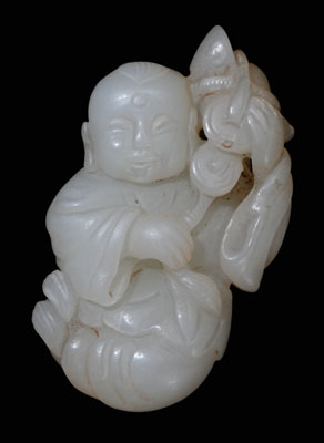 Appraisal: Jade Toggle Qing Dynasty translucent white Xinjiang jade boy seated