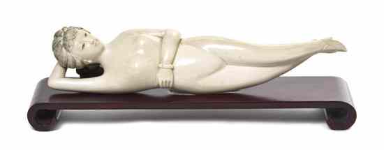 Appraisal: A Chinese Carved Ivory Doctor's Model the recumbent figure shown