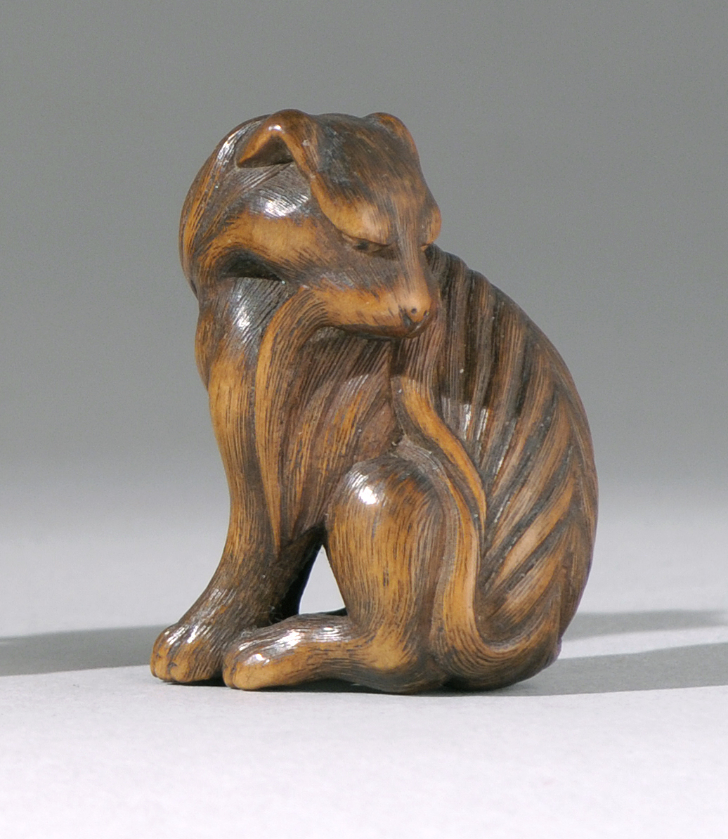 Appraisal: WOOD NETSUKE Late th Early th CenturyDepicting a dog with